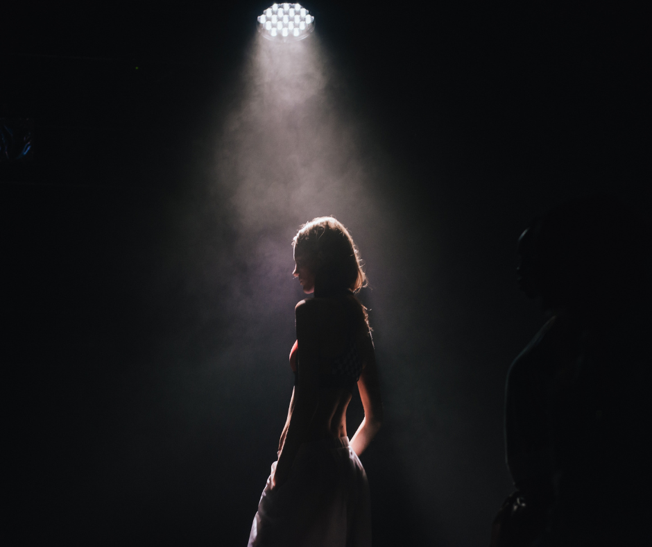 Woman in Spotlight Theory